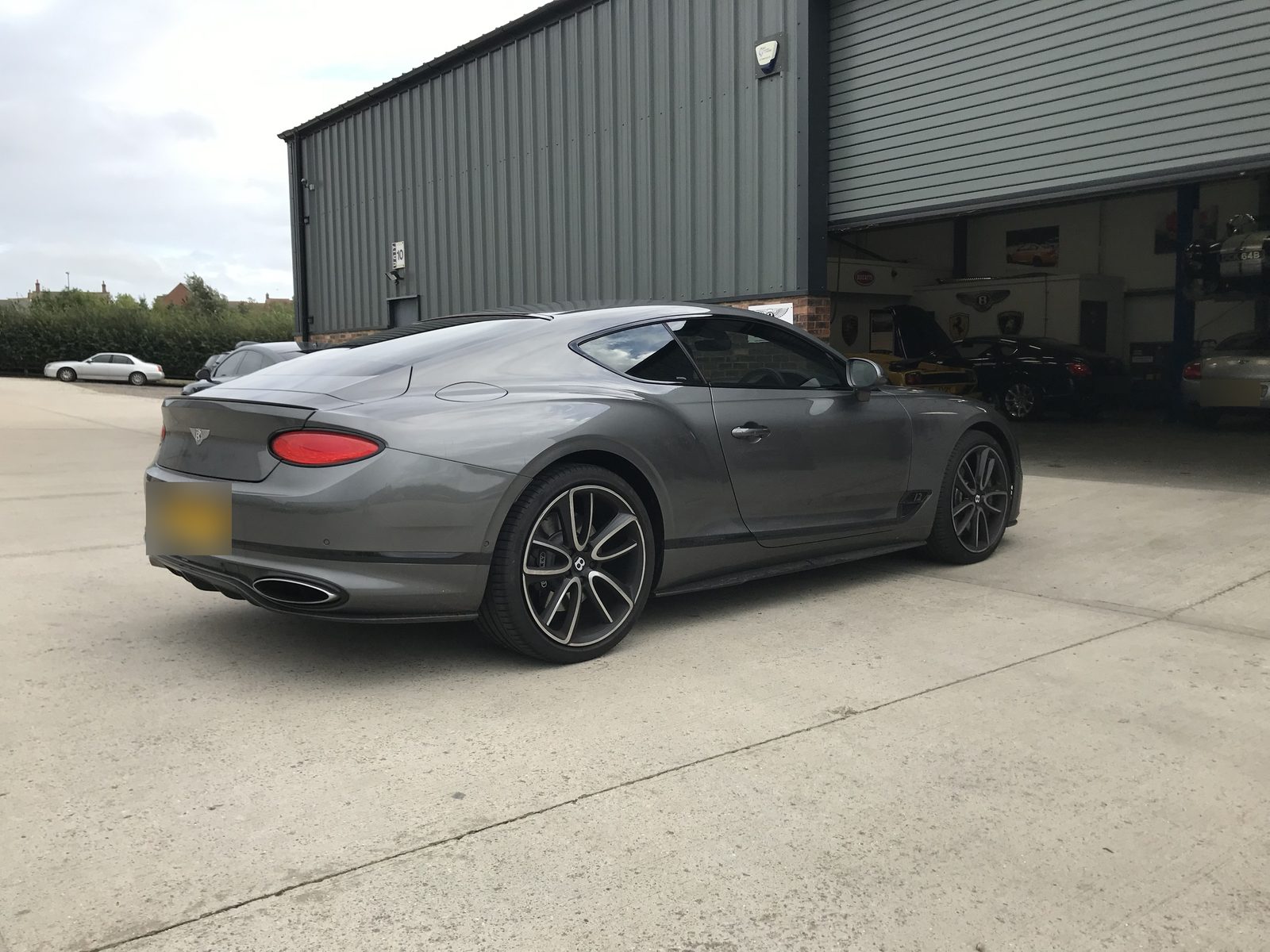 Grey Bentley Continental GT with tinted rear glass
