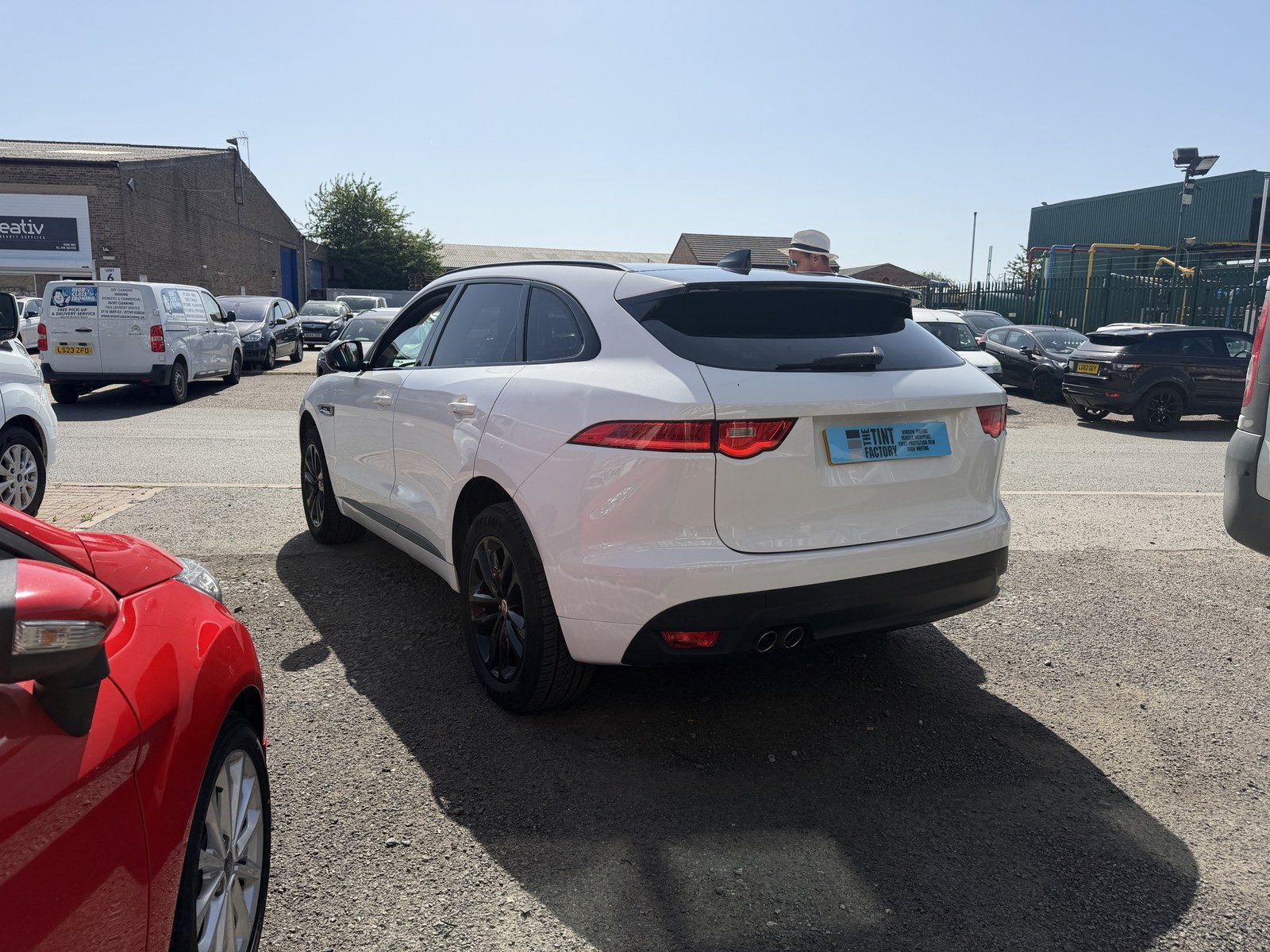 White Jaguar F-Pace with tinted rear glass outside Unit 3
