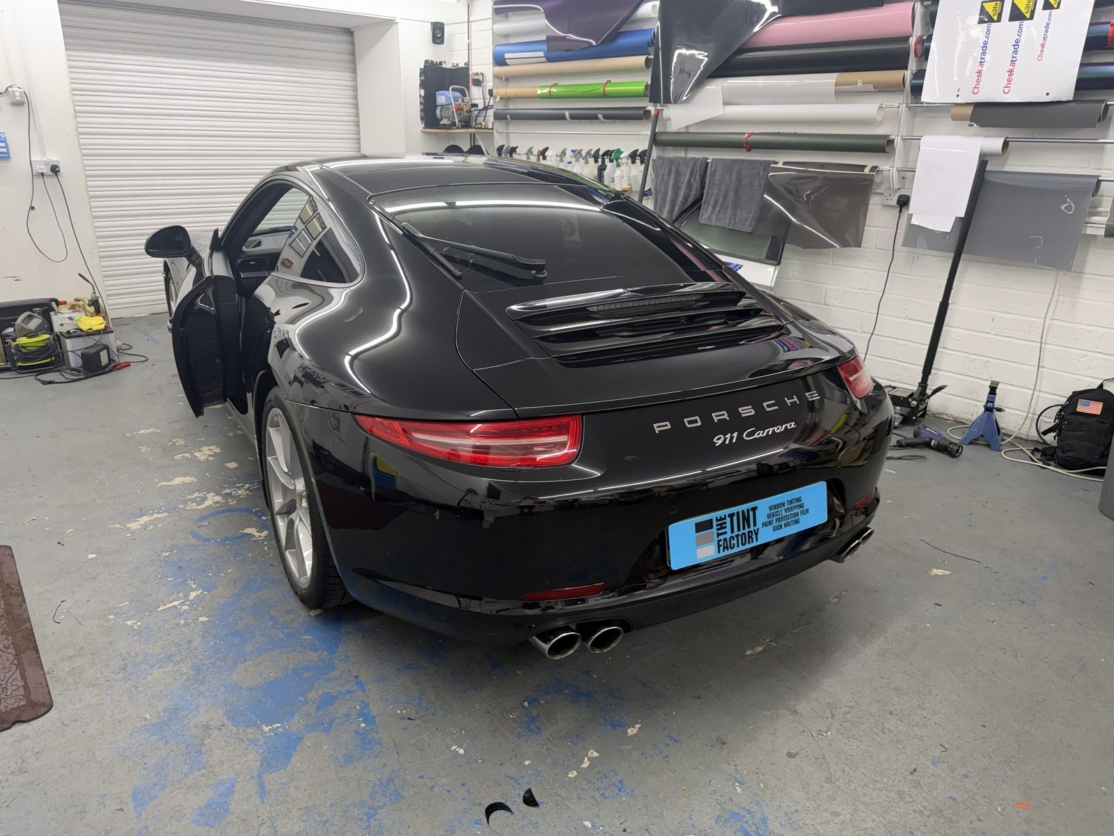 Black Porsche 911 Carrera with freshly tinted rear glass in The Tint Factory workshop, Queniborough