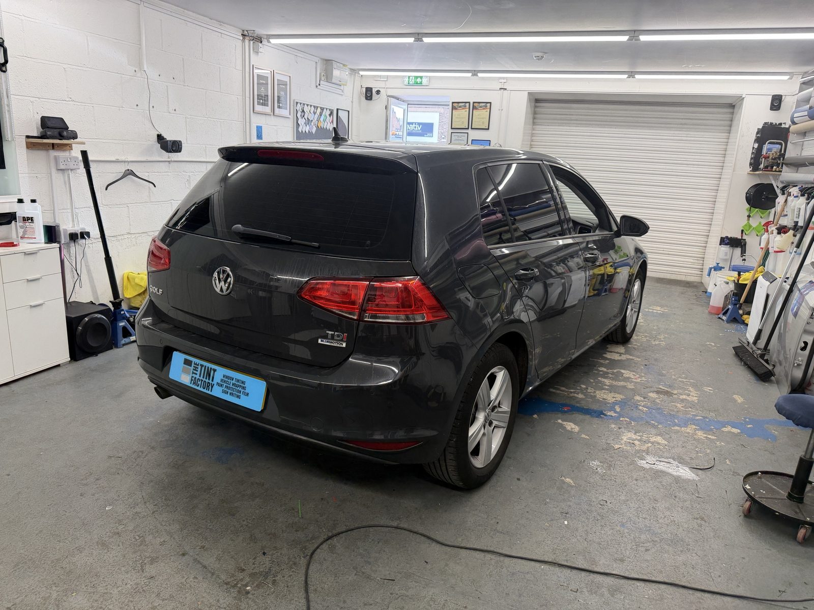 Grey Volkswagen Golf Mk7 with tinted rear windows in the workshop